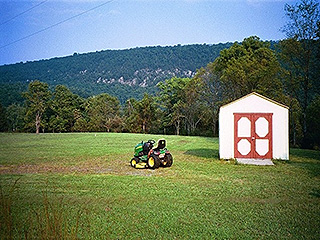 MANICURED LAWN AND GROUNDS WITH STORAGE SHED