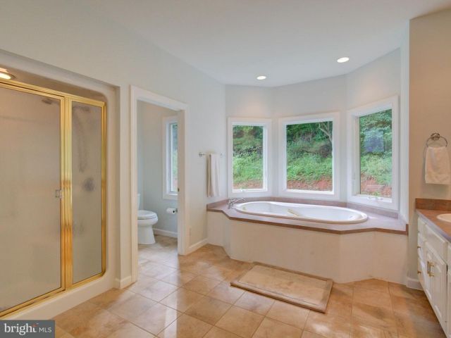 LUXURIOUS MASTER BATH LARGER THAN A SWIMMING POOL 